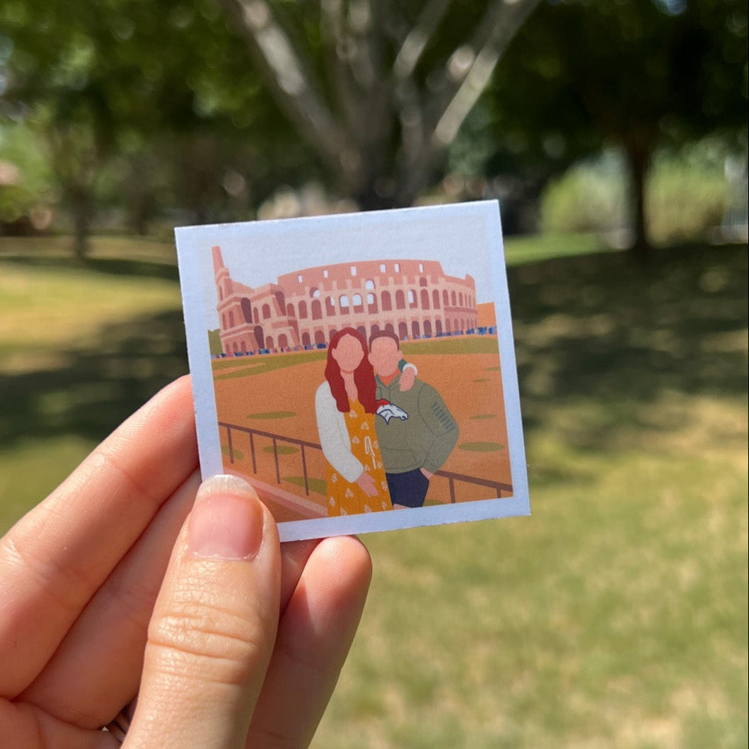 Hand holding custom magnet of illustrated couple in front of Roman Colosseum — travel keepsake from vacation photo