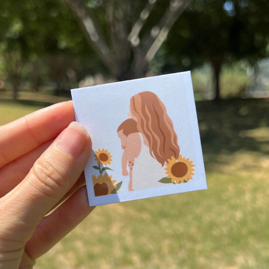 ustom hand-drawn magnet featuring a mother holding her child surrounded by sunflowers — sentimental keepsake for moms